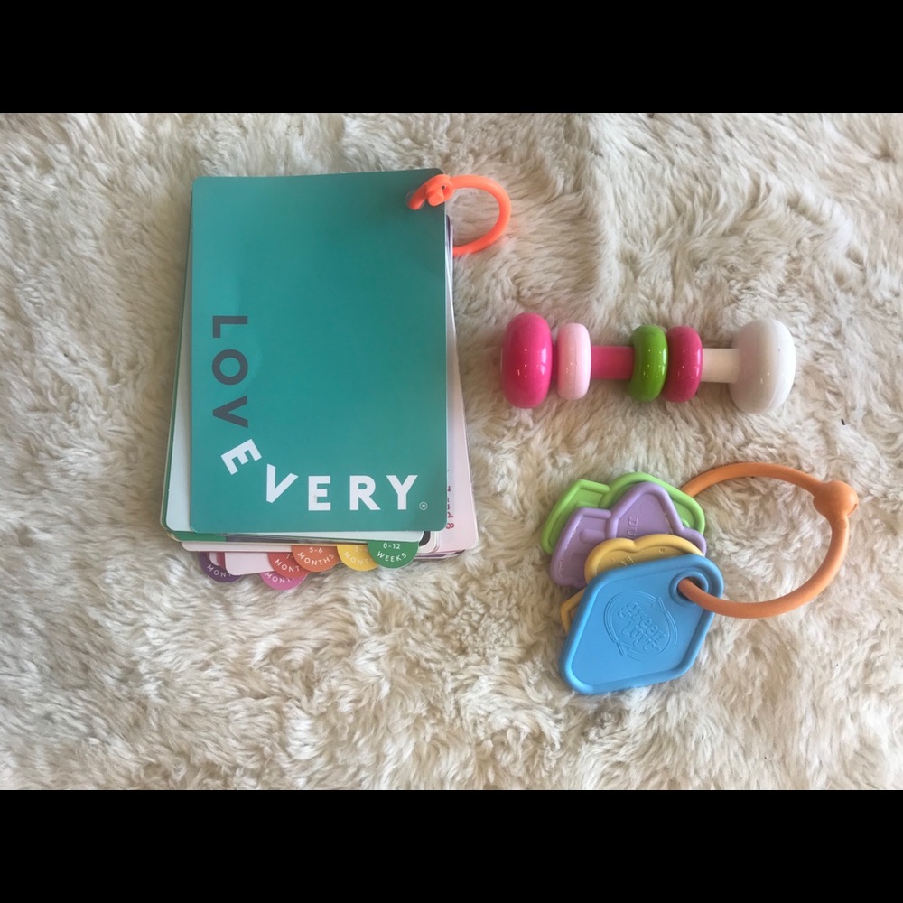 Lovevery activity booklet and teething toys
